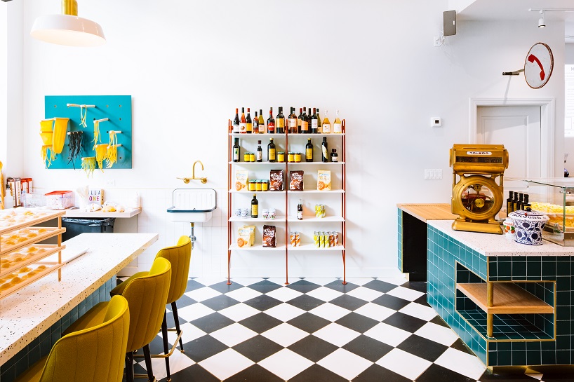 siren betty design suspends a teal blue vespa in chicago's tortello pasta shop designboom