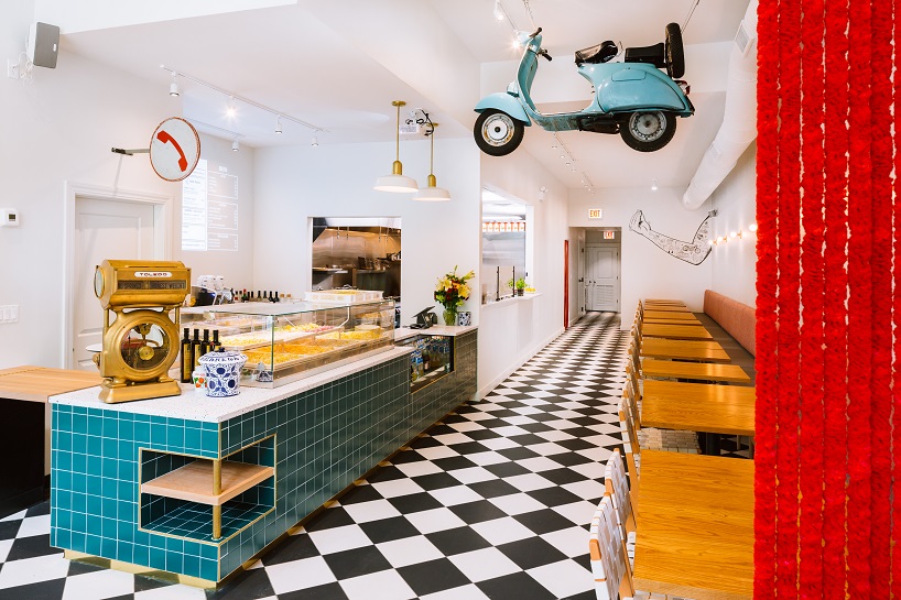 siren betty design suspends a teal blue vespa in chicago's tortello pasta shop designboom