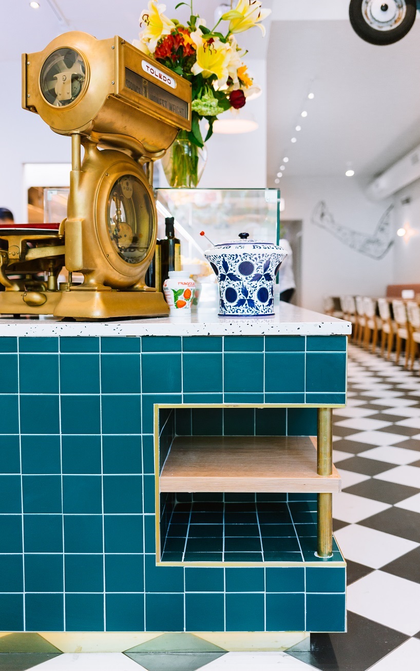 siren betty design suspends a teal blue vespa in chicago's tortello pasta shop designboom