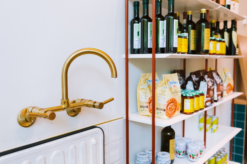 siren betty design suspends a teal blue vespa in chicago's tortello pasta shop designboom