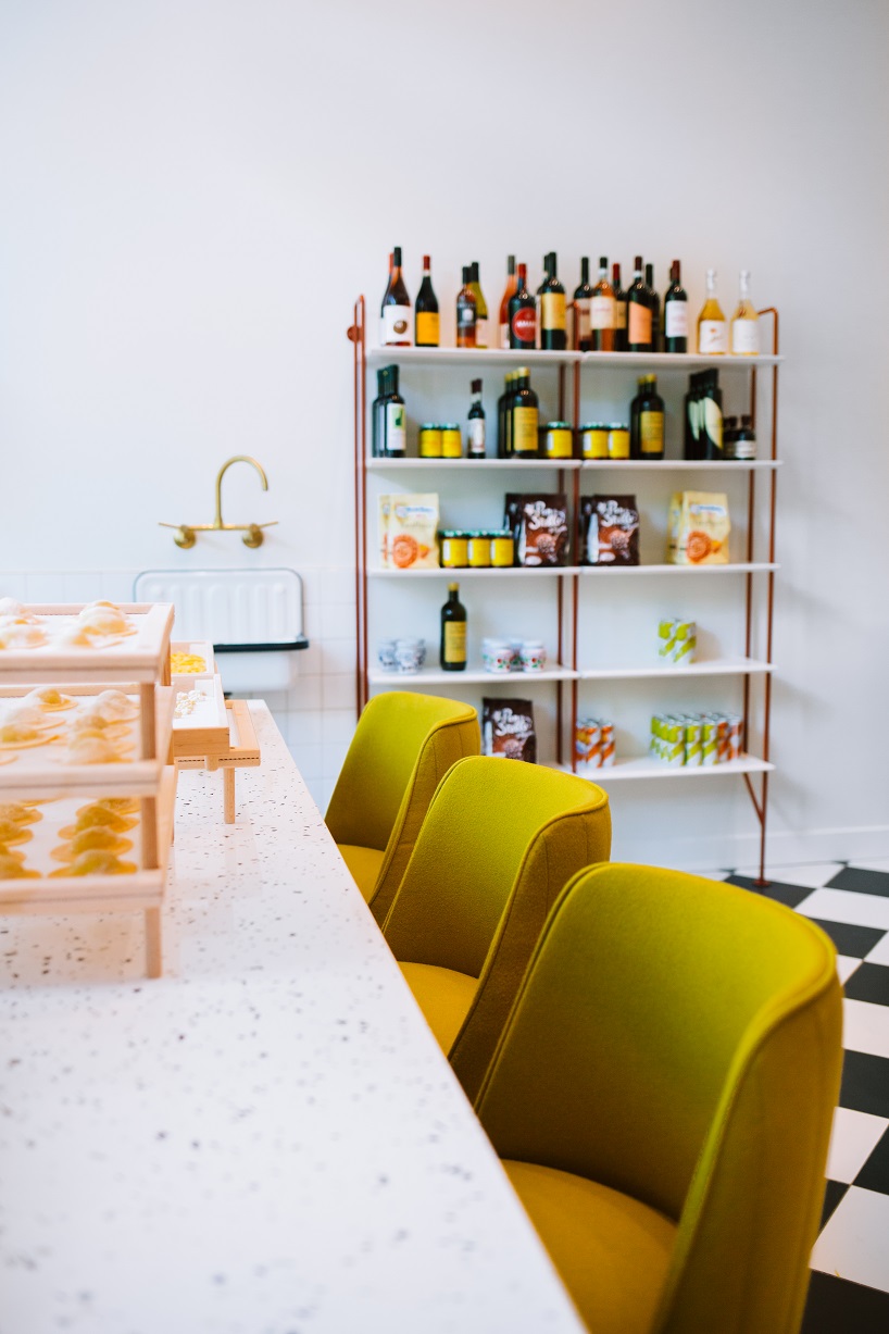 siren betty design suspends a teal blue vespa in chicago's tortello pasta shop designboom
