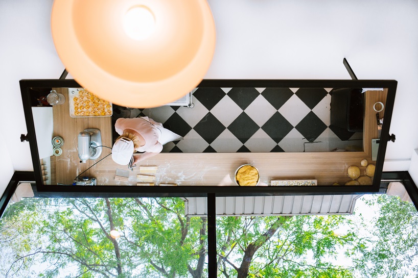 siren betty design suspends a teal blue vespa in chicago's tortello pasta shop designboom