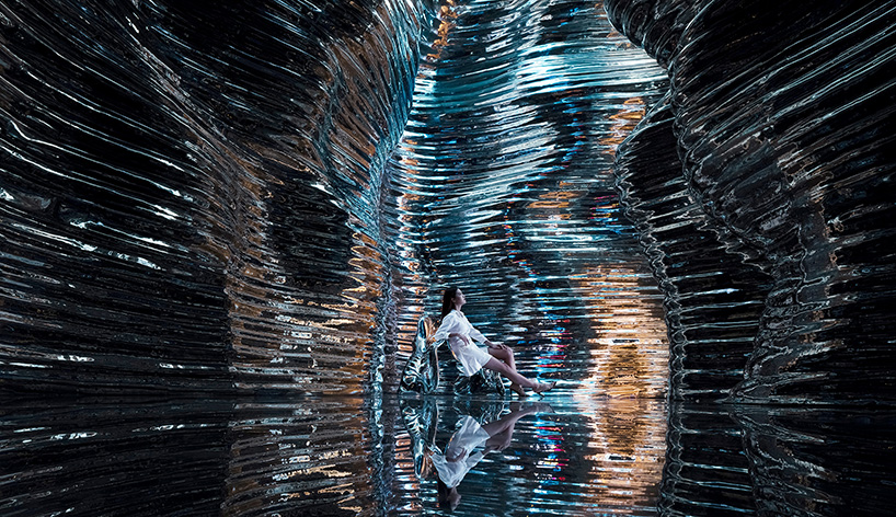 foshan topway design creates reflective canyon-like steel interior for 'zcmetal' exhibition hall in china