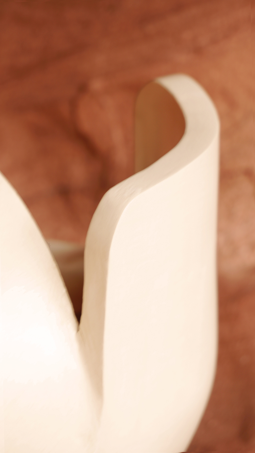 curving lines of puigmigliore's ceramic terra lamps emit diffuse lighting