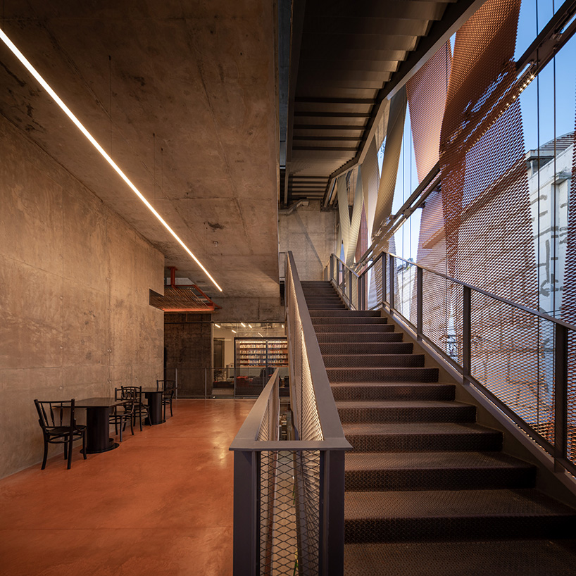 metal mesh skin adorns art center's concrete facade in bangkok