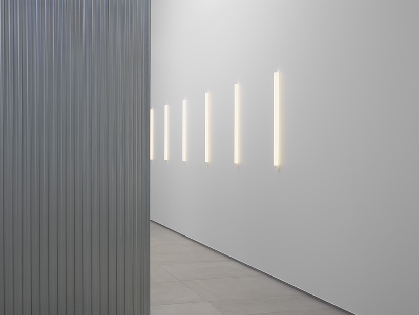 aluminum and polycarbonate plates add an industrial touch to minimal japanese hair salon