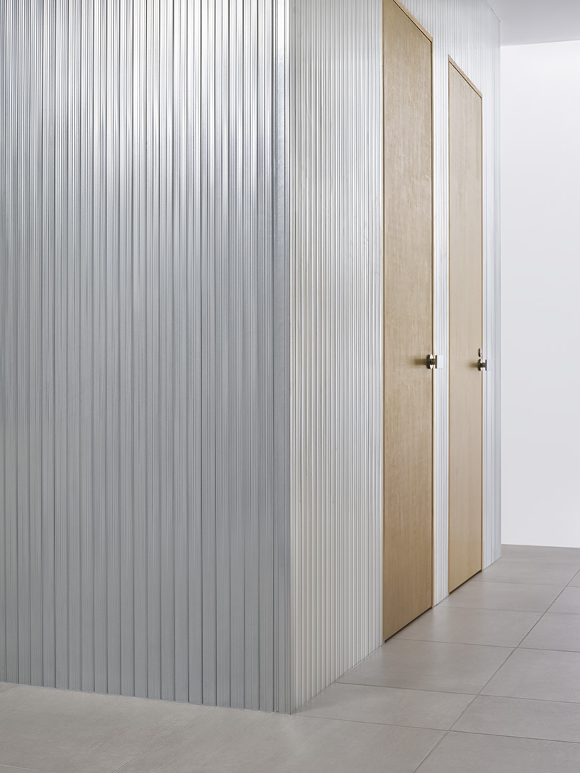 aluminum and polycarbonate plates add an industrial touch to minimal japanese hair salon