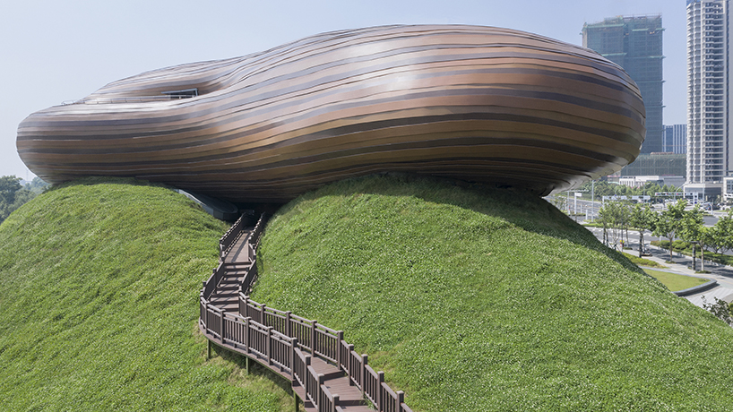 organic lines and undulating greenery form CROX's liyang museum in china designboom