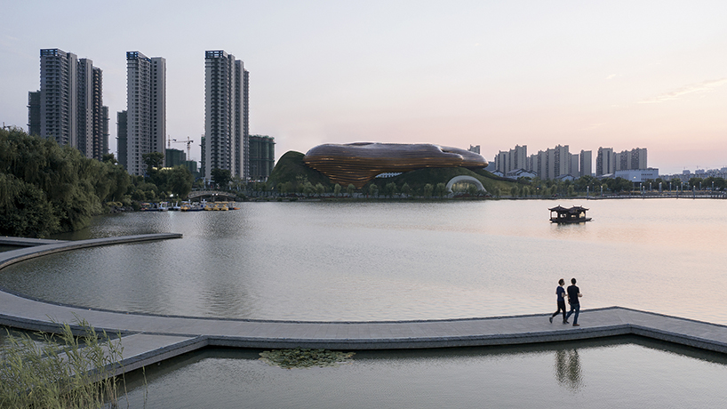 organic lines and undulating greenery form CROX's liyang museum in china designboom