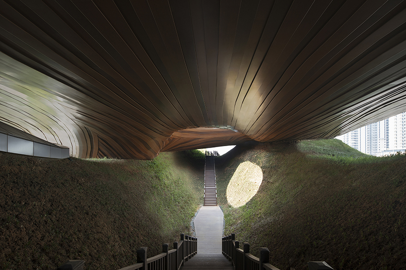 organic lines and undulating greenery form CROX's liyang museum in china designboom