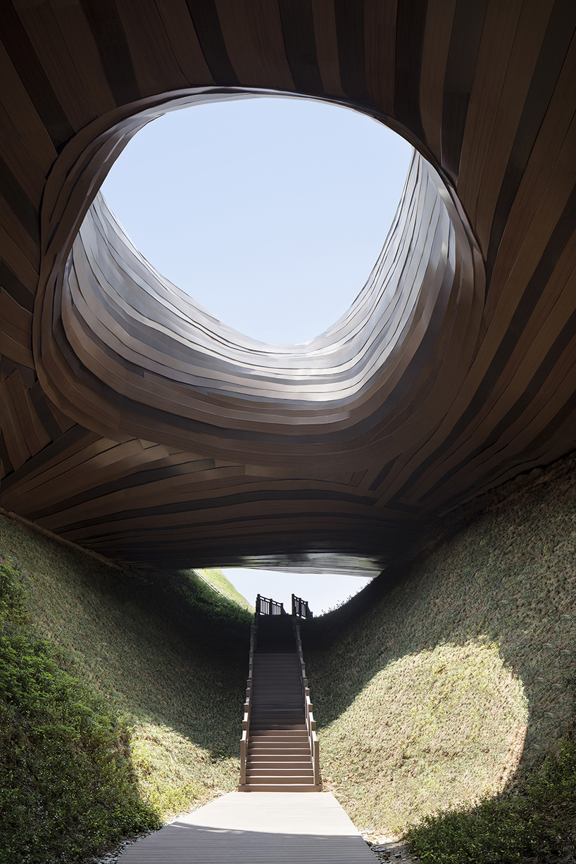 organic lines and undulating greenery form CROX's liyang museum in china designboom