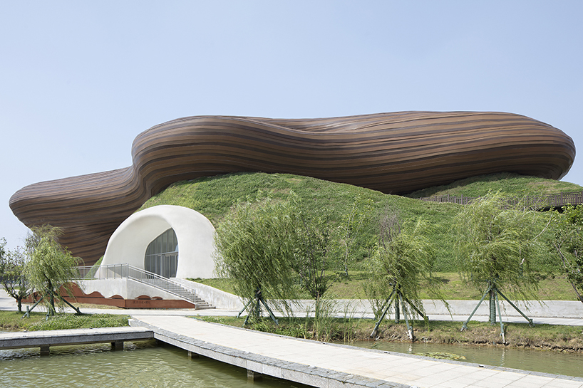 organic lines and undulating greenery form CROX's liyang museum in china designboom