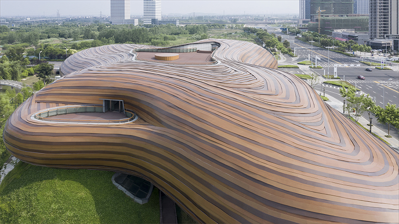 organic lines and undulating greenery form CROX's liyang museum in china designboom
