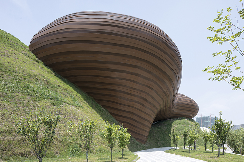 organic lines and undulating greenery form CROX's liyang museum in china designboom