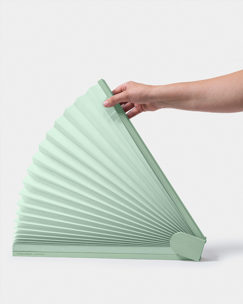 njustudio presents a pleated pop-up screen that brings privacy to open spaces