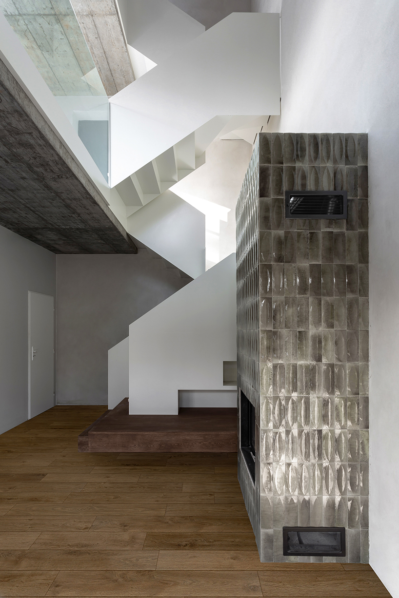 timber-clad cottage jaro by edit! interacts with forest sloping site in the czech republic