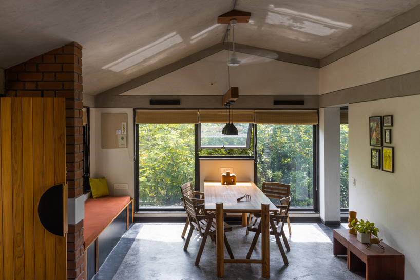 red brickwork encloses the introverted courtyard of urban farm house in india