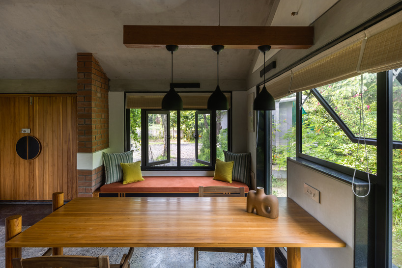 red brickwork encloses the introverted courtyard of urban farm house in india