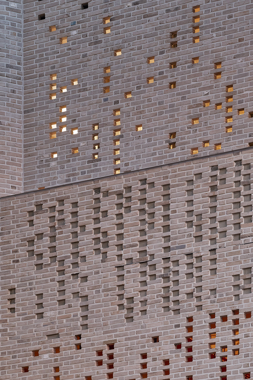 perforated brickwork forms pixelated pattern upon restored seoul building by NOMAL