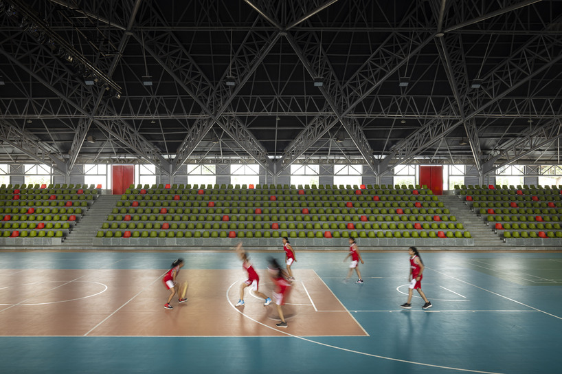 pyramidal steel roof by thirdspace tops university's sports arena in india