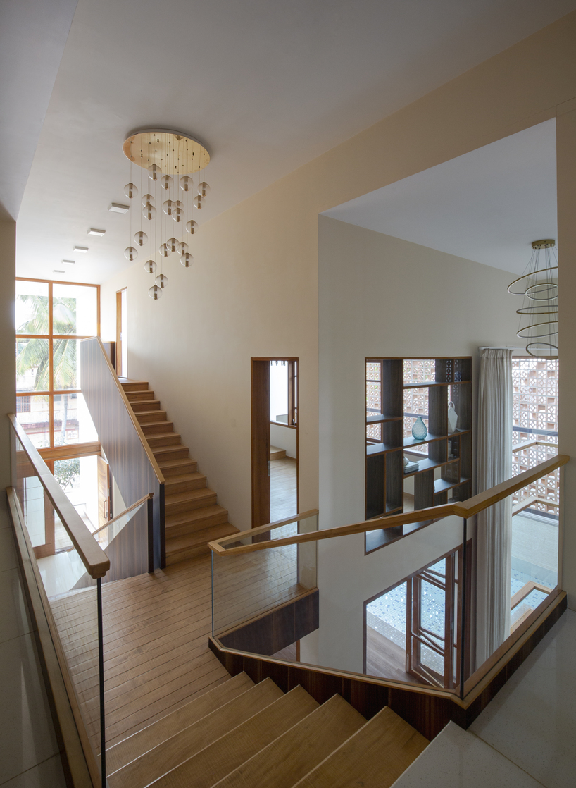 perforated terracotta screens enclose pool pavilion within indian residence