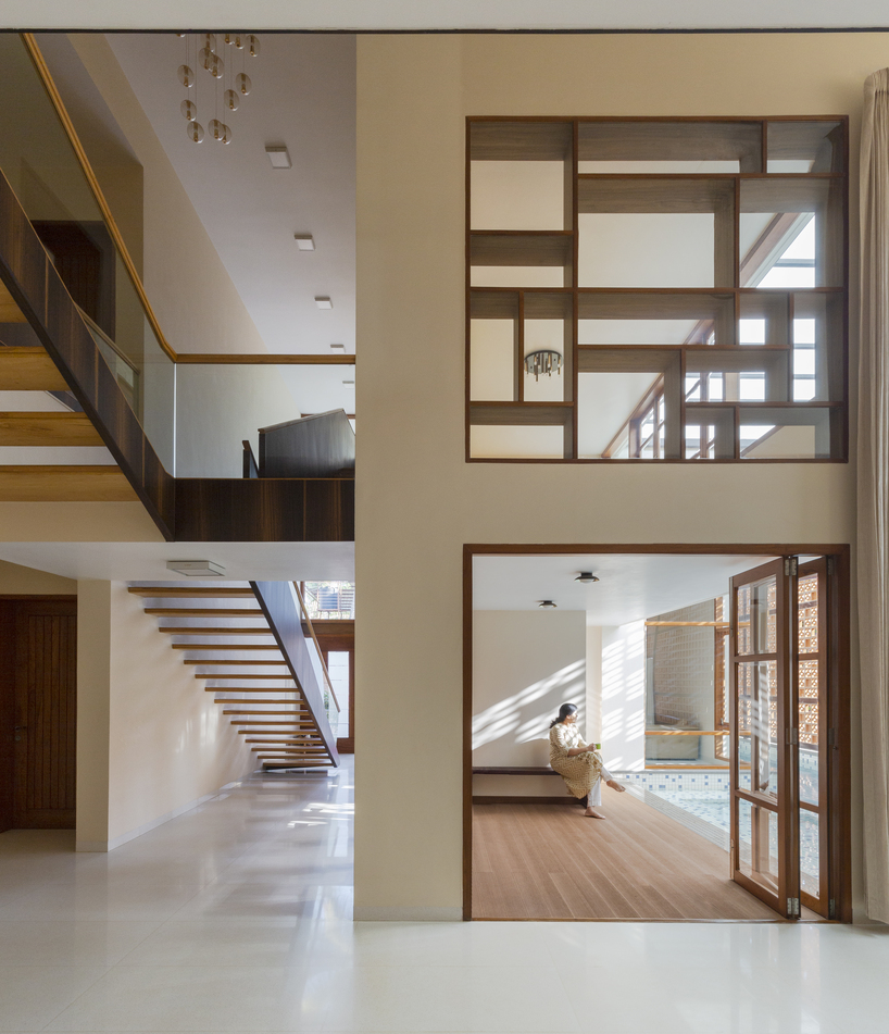 perforated terracotta screens enclose pool pavilion within indian residence