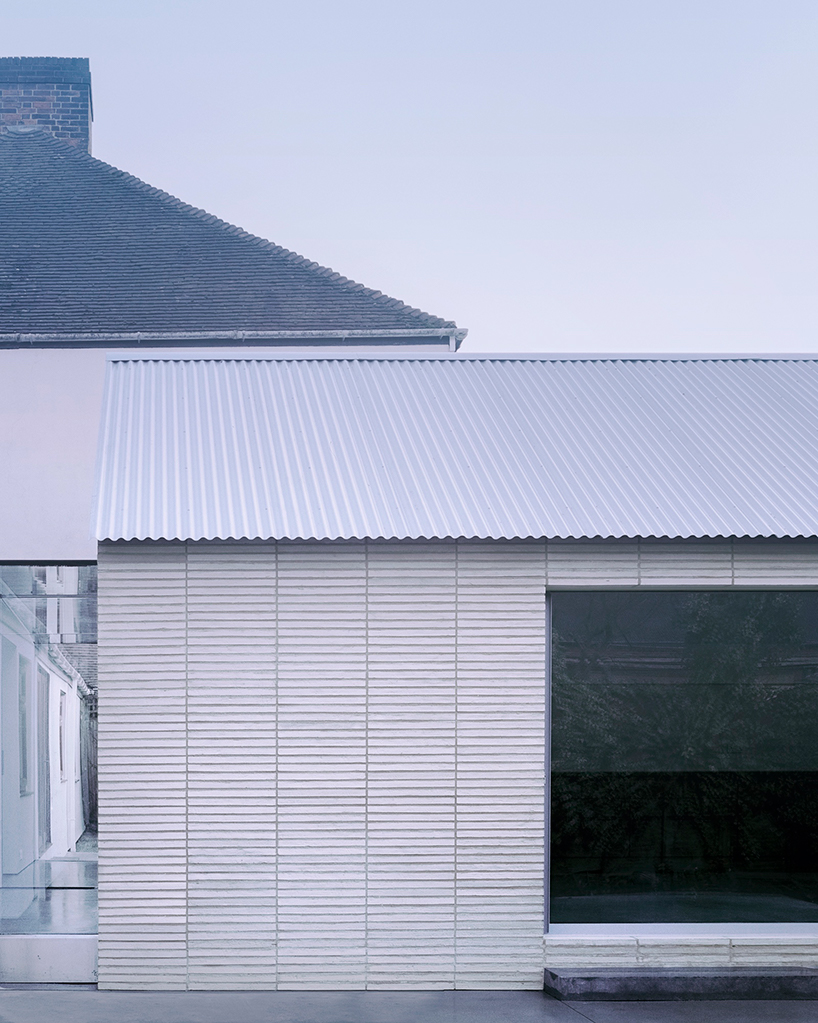 jonathan burlow stacks white narrow bricks for a contemporary home in england