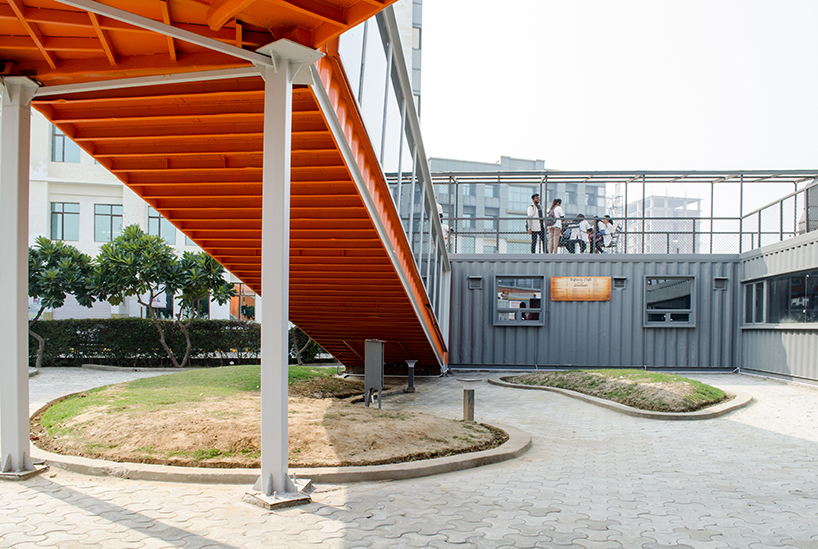 RJDL builds cafe infinity from recycled shipping containers in india