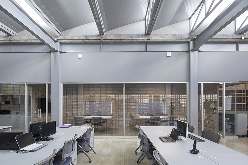 a concrete lattice clads a modular office in mexico designed by morari arquitectura + JAA designboom