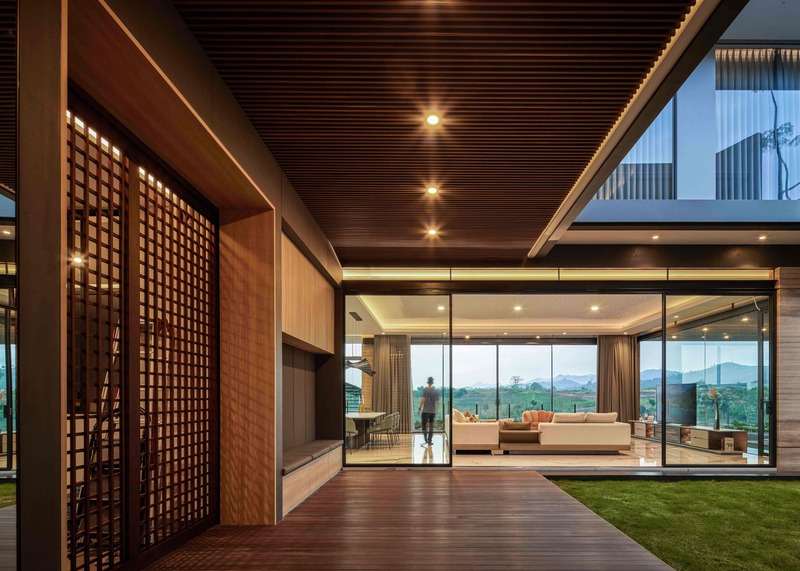 rakta studio designs idyllic infinity pool protruding from SM house to enjoy panoramic lakeside views in indonesia