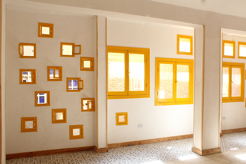 ahmed hossam saafan builds a yellow cultural center in one of cairo's most populated slums