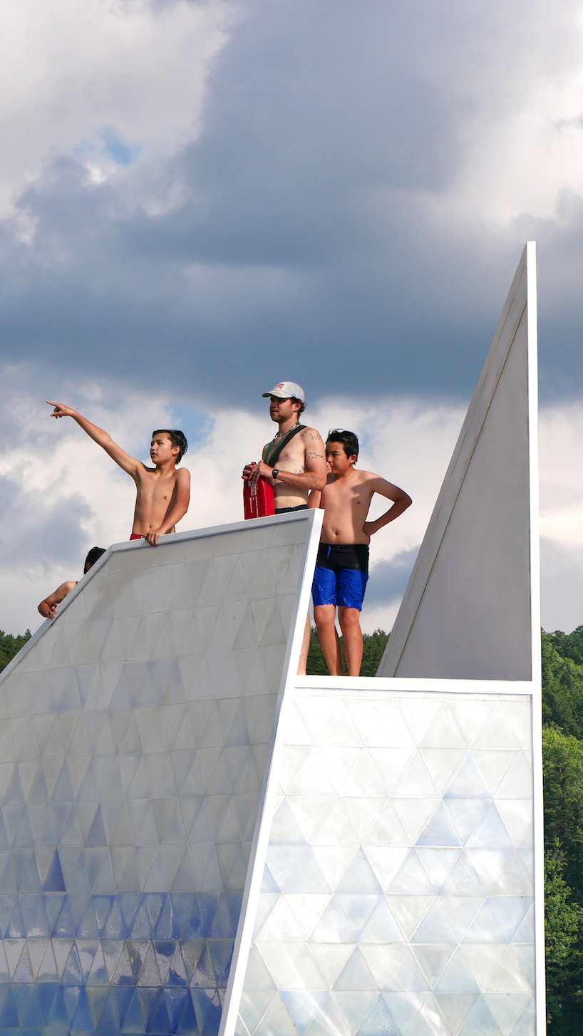 thermochromic tiles of recycled HDPE clad the 'iceberg' diving platform by bulot+collins designboom