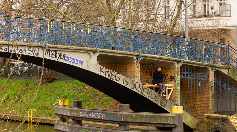 brückenbunker is an urban micro refuge tucked under a pedestrian bridge in berlin designboom