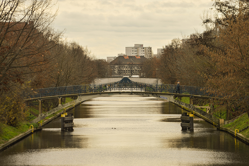 brückenbunker is an urban micro refuge tucked under a pedestrian bridge in berlin designboom