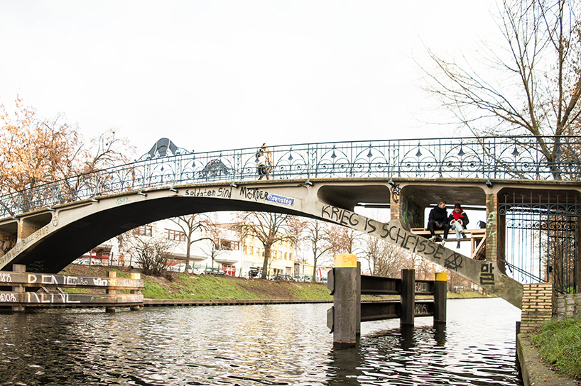 brückenbunker is an urban micro refuge tucked under a pedestrian bridge in berlin designboom