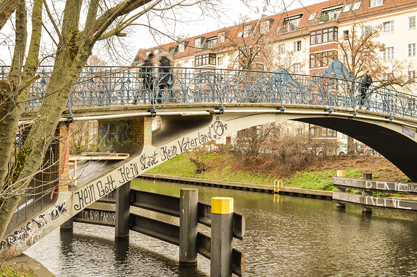 brückenbunker is an urban micro refuge tucked under a pedestrian bridge in berlin designboom