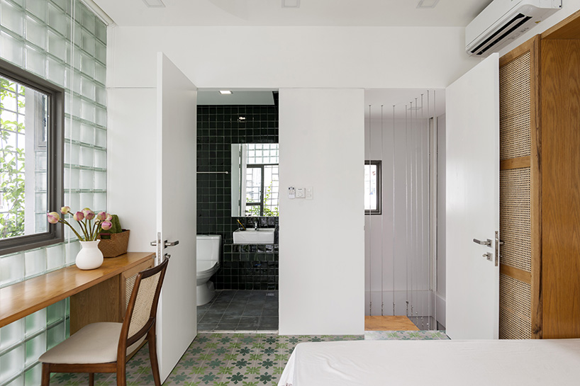 room+ design & build renovates tiny house in vietnam with glass-block façades