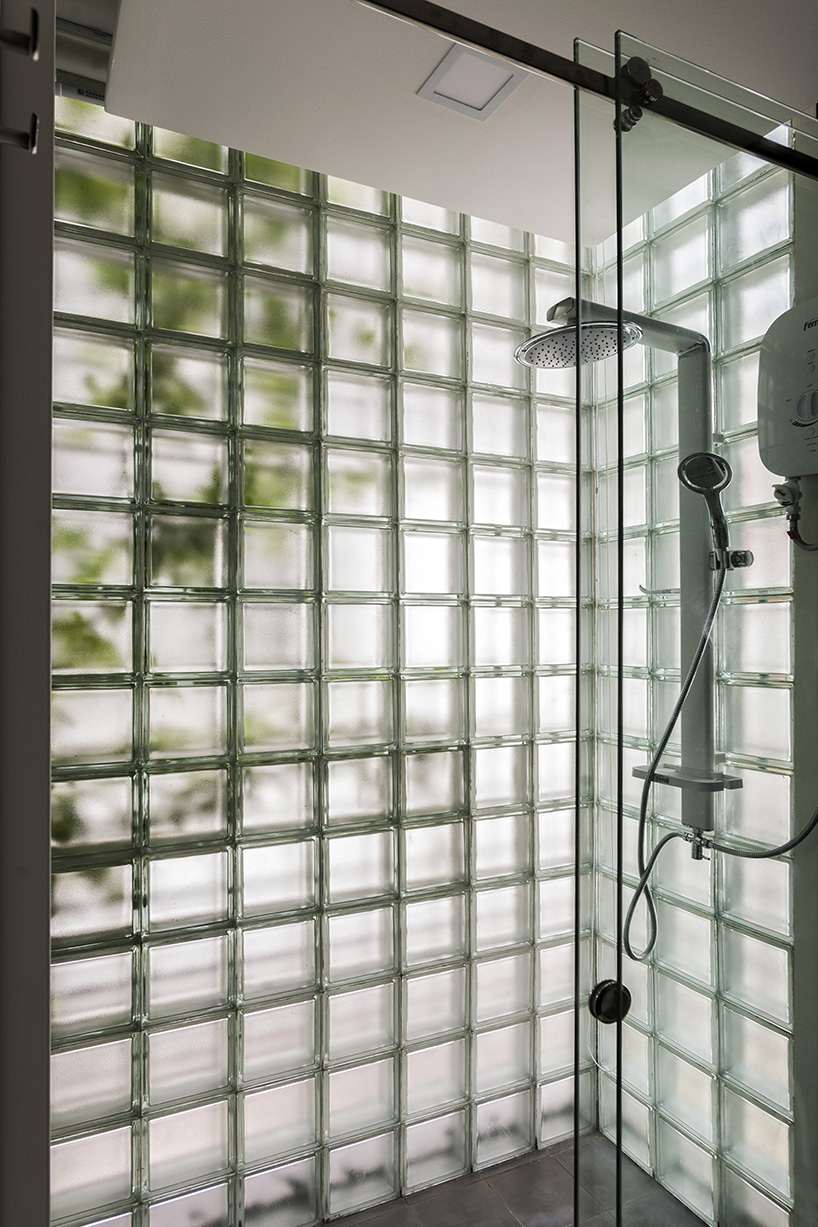 room+ design & build renovates tiny house in vietnam with glass-block façades