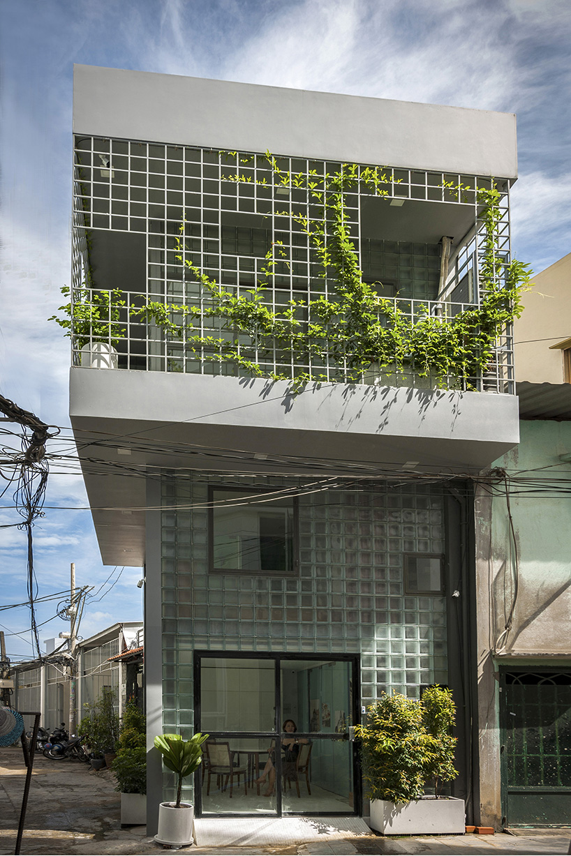room+ design & build renovates tiny house in vietnam with glass-block façades