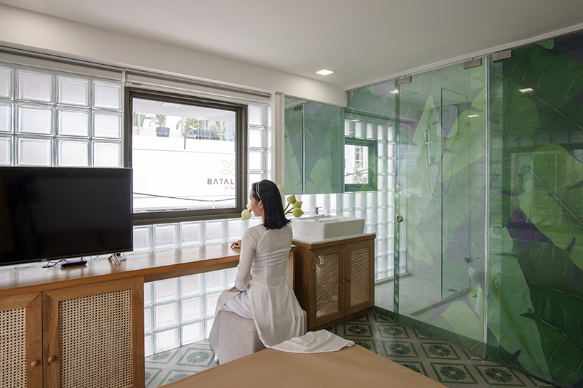 room+ design & build renovates tiny house in vietnam with glass-block façades