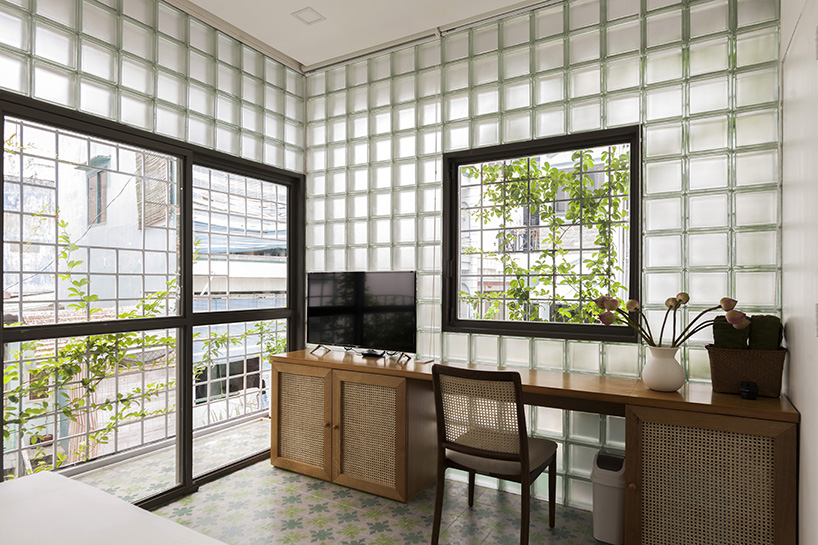 room+ design & build renovates tiny house in vietnam with glass-block façades