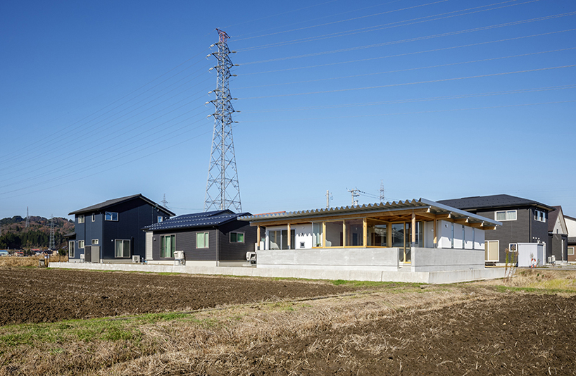 repeatable wooden grid frame supports small 'nanto house' by kazuto nishi architects in japan