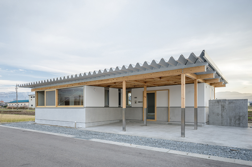 repeatable wooden grid frame supports small 'nanto house' by kazuto nishi architects in japan