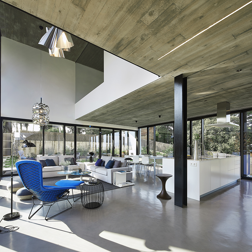 rob dubois articulates barcelona residence in heavy concrete and glass