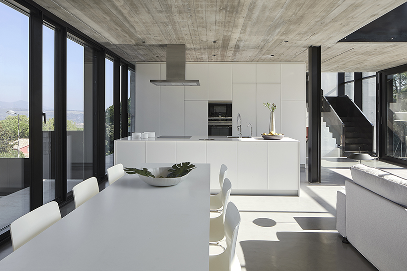 rob dubois articulates barcelona residence in heavy concrete and glass