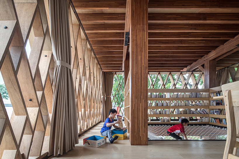 SHAU forms an elevated 'microlibrary' from prefabricated timber in indonesia designboom