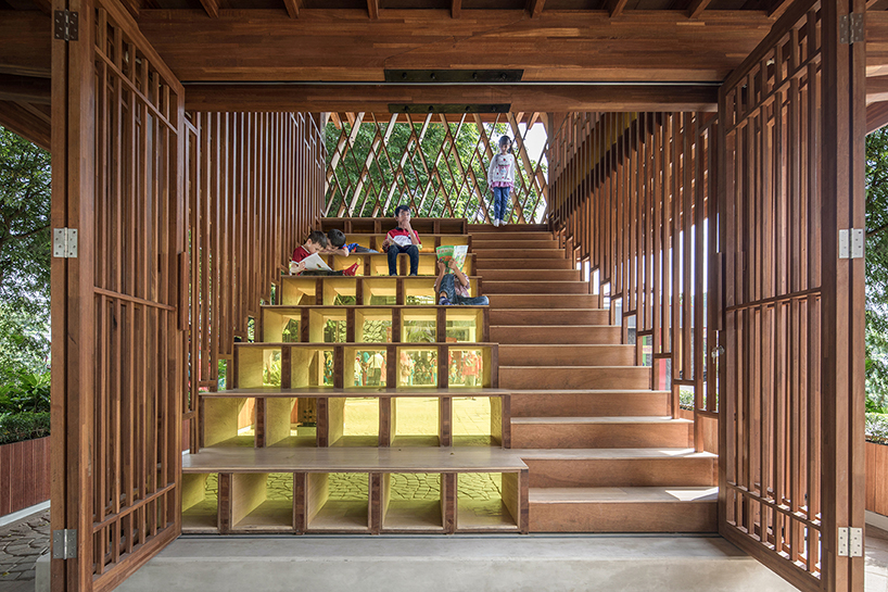 SHAU forms an elevated 'microlibrary' from prefabricated timber in indonesia designboom