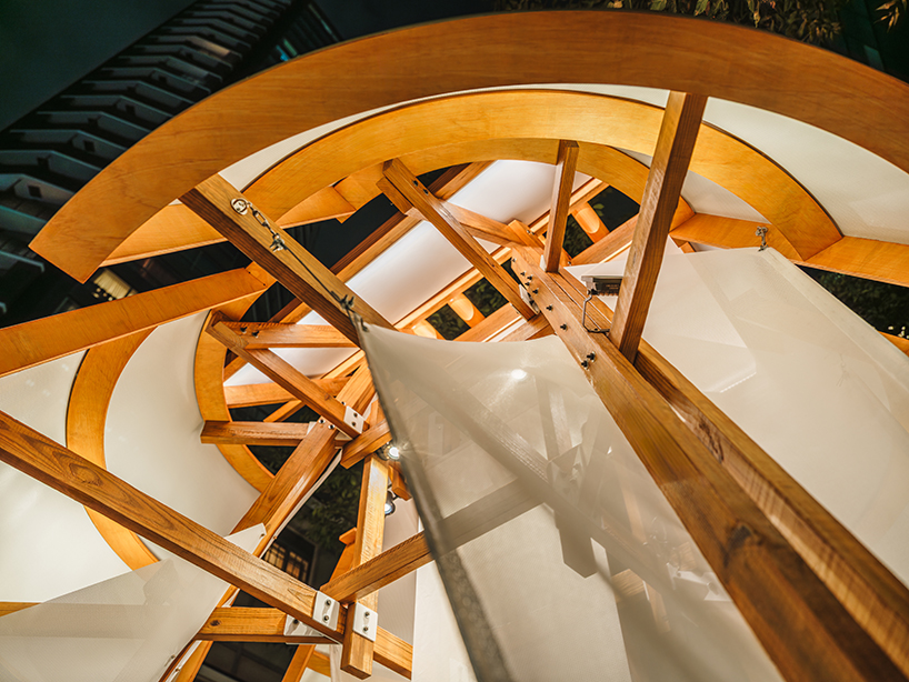 rhythmic layering of wood and fabric weaves sail-inspired installation by cheng tsung feng