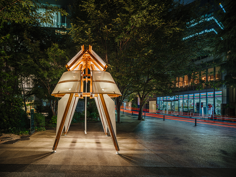 rhythmic layering of wood and fabric weaves sail-inspired installation by cheng tsung feng