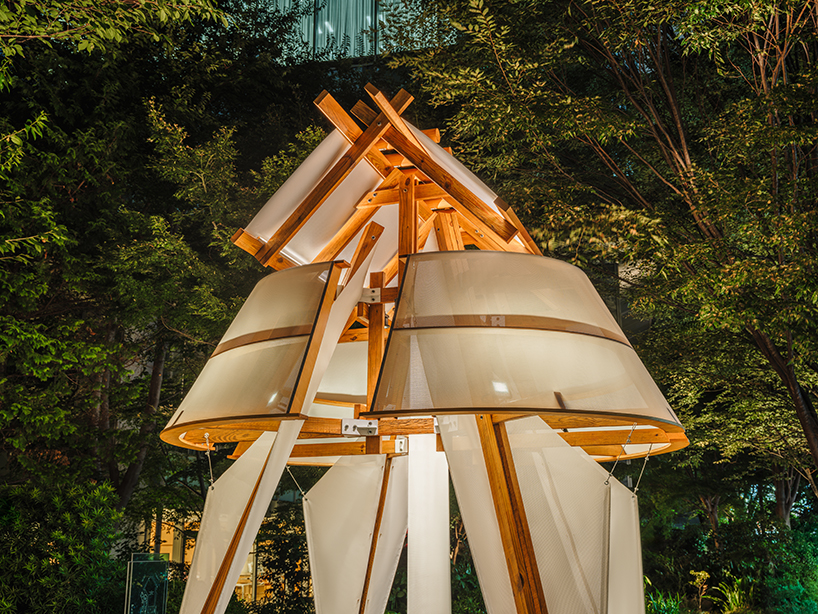 rhythmic layering of wood and fabric weaves sail-inspired installation by cheng tsung feng